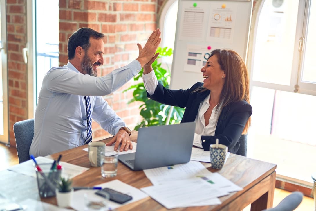 Business team celebrating legal progress